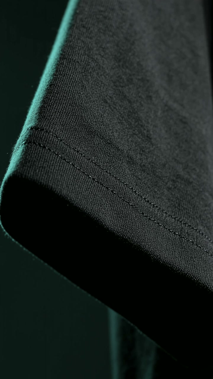 Sleeve hem and stitching on the black tee