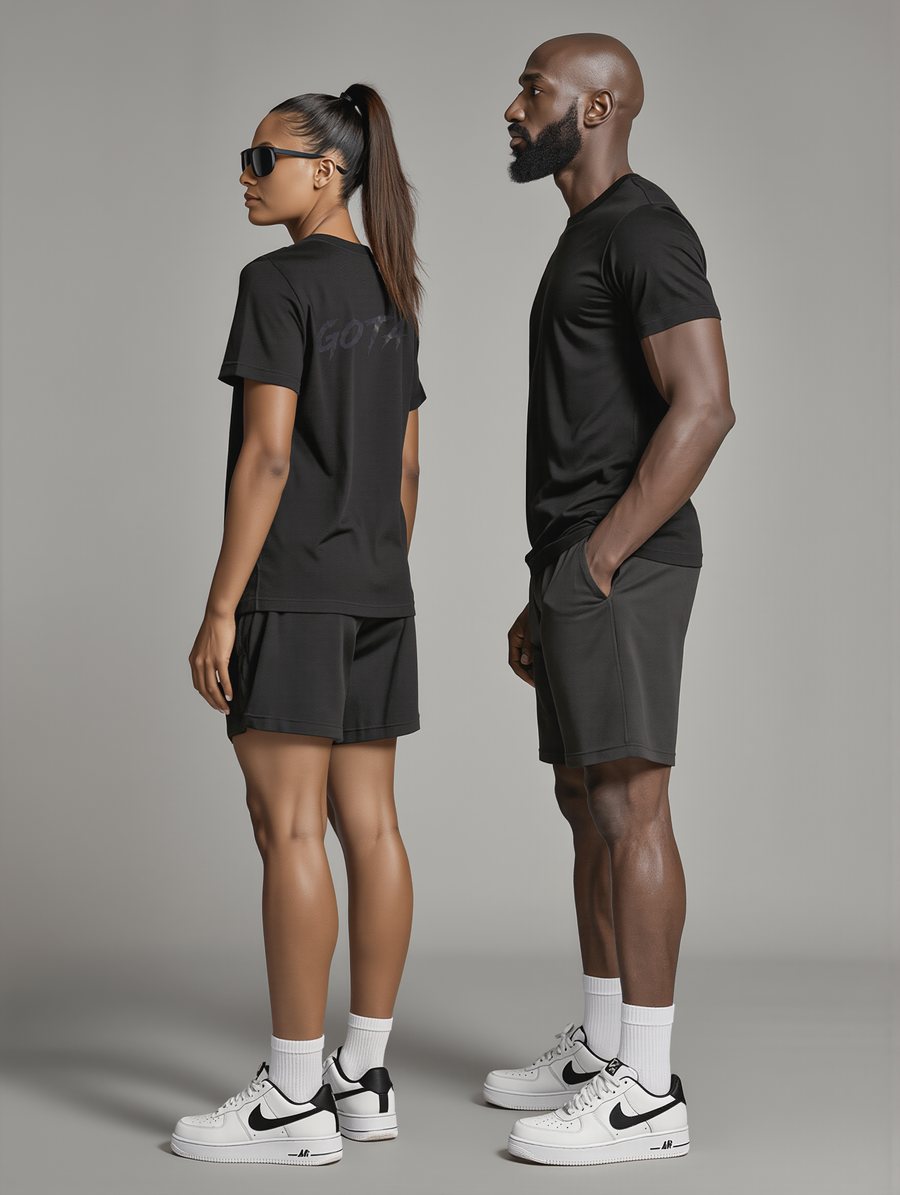 Side view of the black GOTA tee on two people